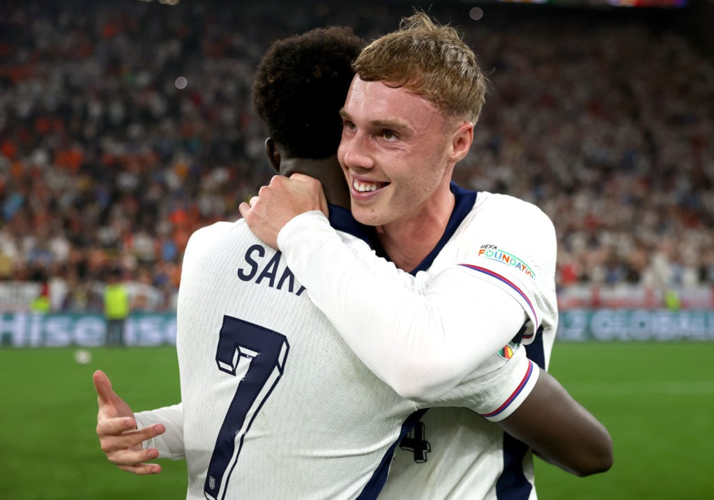 Bukayo Saka and Cole Palmer of England celebrate following the UEFA EURO 2024 semi-final match between Netherlands and England at Football Stadium ...