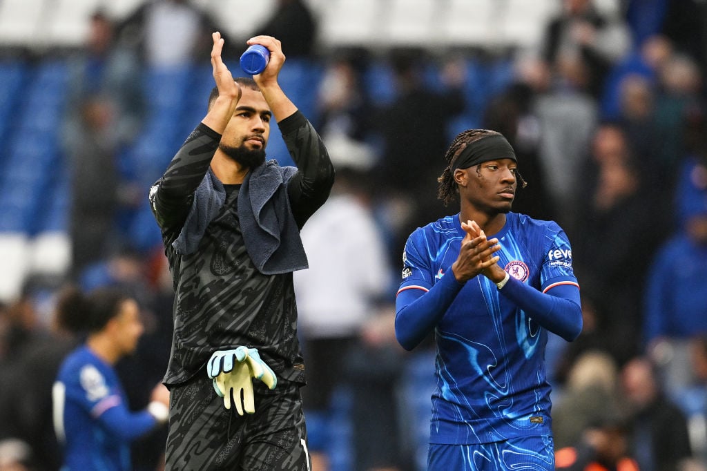 Robert Sanchez and Noni Madueke applaud Chelsea's fans.