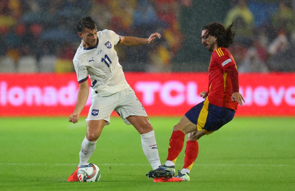 Lazar Samardzic of Serbia is challenged by Marc Cucurella of Spain during the UEFA Nations League 2024/25 League A Group A4 match between Spain and...