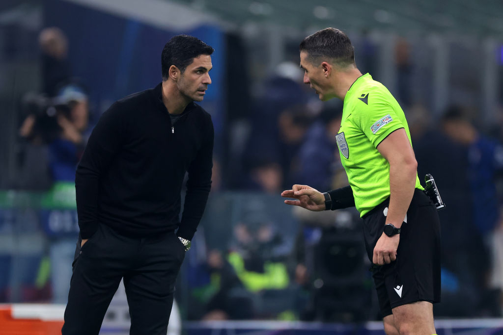The Referee Istvan Kovacs of Romania warns Mikel Arteta Arsenal FC Head Coach about his conduct with the Argentianian already having been booked du...