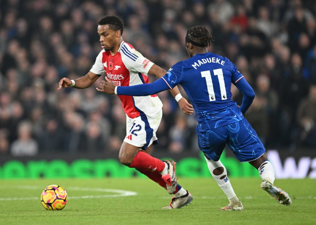Jurrien Timber of Arsenal breaks past Noni Madueke of Chelsea during the Premier League match between Chelsea FC and Arsenal FC