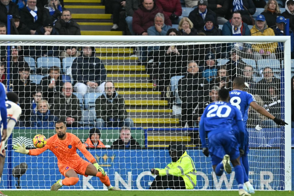 Leicester City's French-born Ghanaian striker #18 Jordan Ayew (R) scores their first goal from the penalty spot during the English Premier League f...