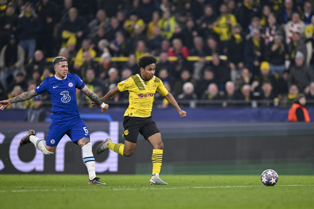 Enzo Fernandez of Chelsea FC and Karim Adeyemi of Borussia Dortmund battle for the ball during the UEFA Champions League round of 16 leg one match ...