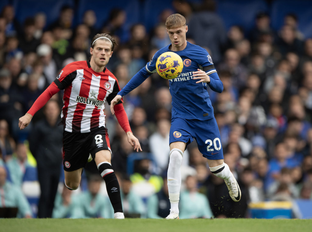 Cole Palmer of Chelsea (right) and Mathias Jensen of Brentford during the Premier League match between Chelsea FC and Brentford FC at Stamford Brid...