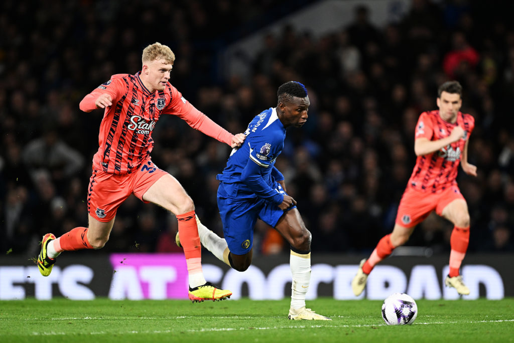 Jarrad Branthwaite of Everton and Nicolas Jackson of Chelsea chase the ball during the Premier League match between Chelsea FC and Everton FC at St...