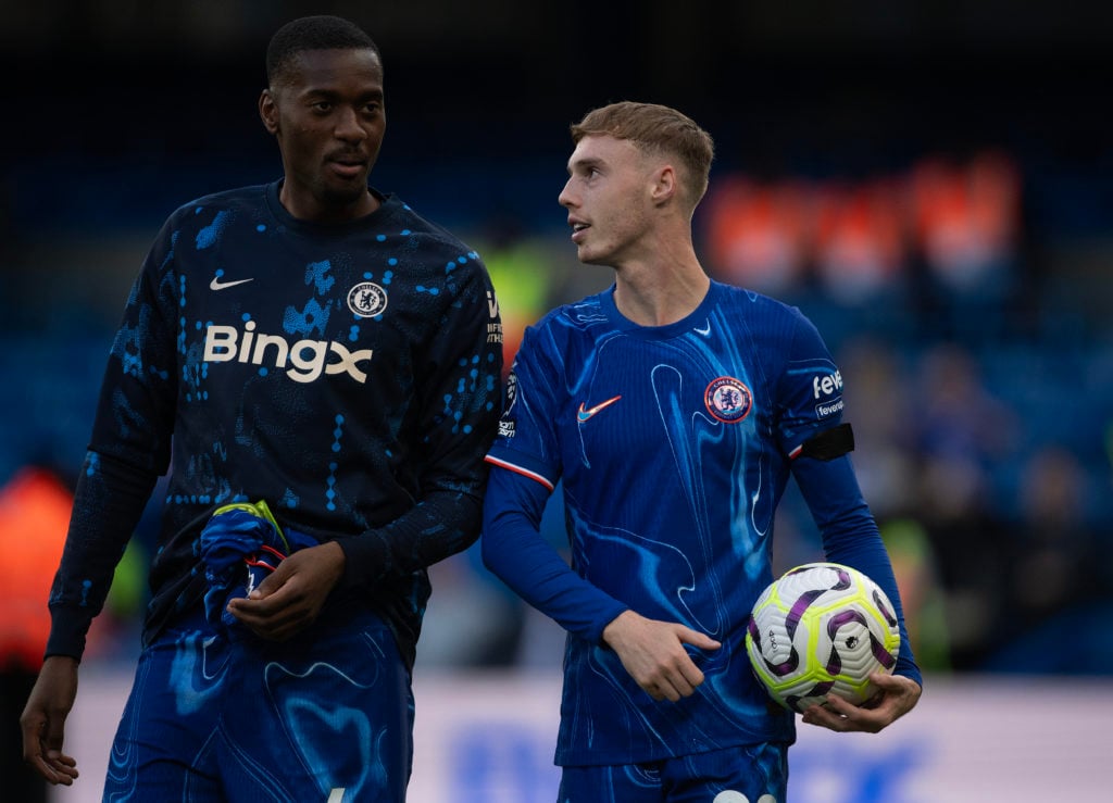 Tosin Adarabioyo of Chelsea and Cole Palmer (holding the match football after scoring four goals) after the Premier League match between Chelsea FC...