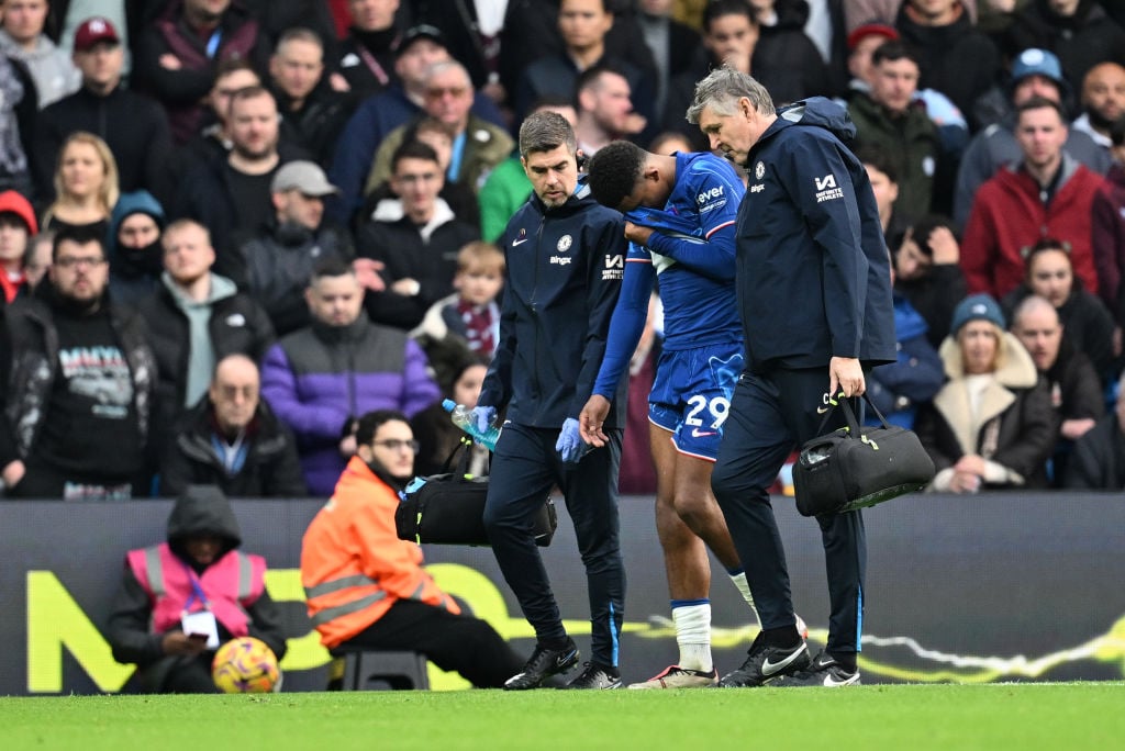 Wesley Fofana of Chelsea reacts with an injury as he leaves the pitch during the Premier League match between Chelsea FC and Aston Villa FC at Stam...