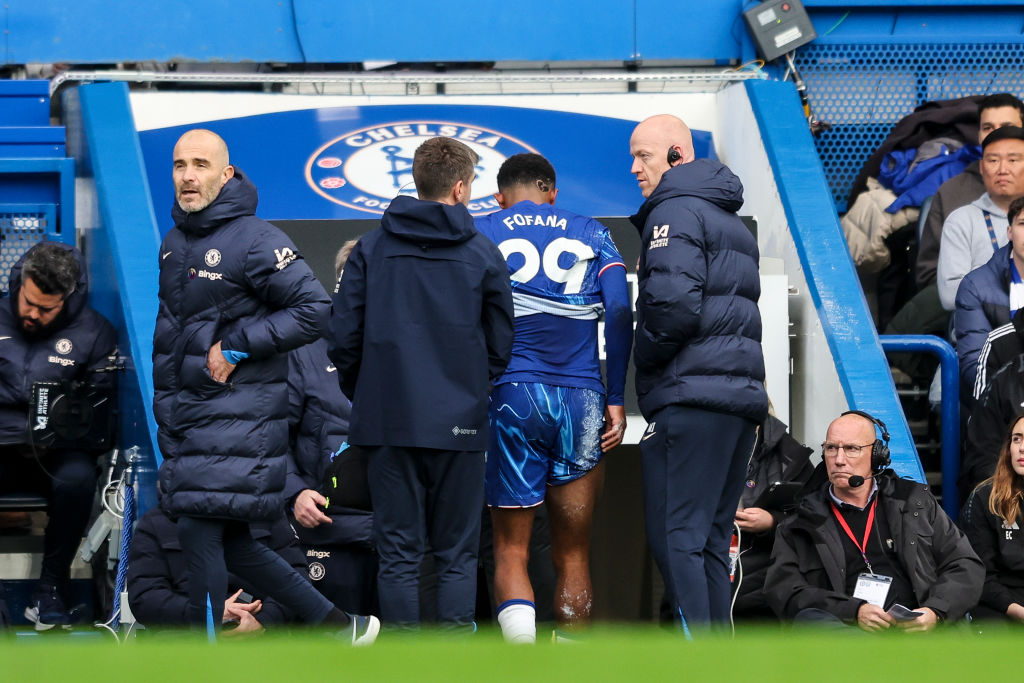 Wesley Fofana of Chelsea goes off injured during the Premier League match between Chelsea FC and Aston Villa FC at Stamford Bridge on December 01, ...