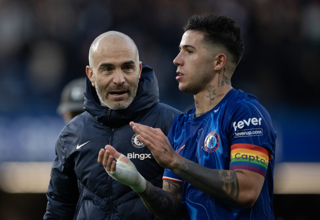 Chelsea manager Enzo Maresca chats with Enzo Fernandez after the Premier League match between Chelsea FC and Aston Villa FC at Stamford Bridge on D...