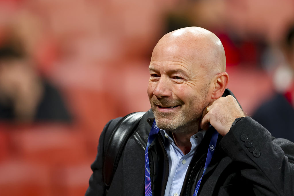 Alan Shearer working as a pundit at a Champions League match.