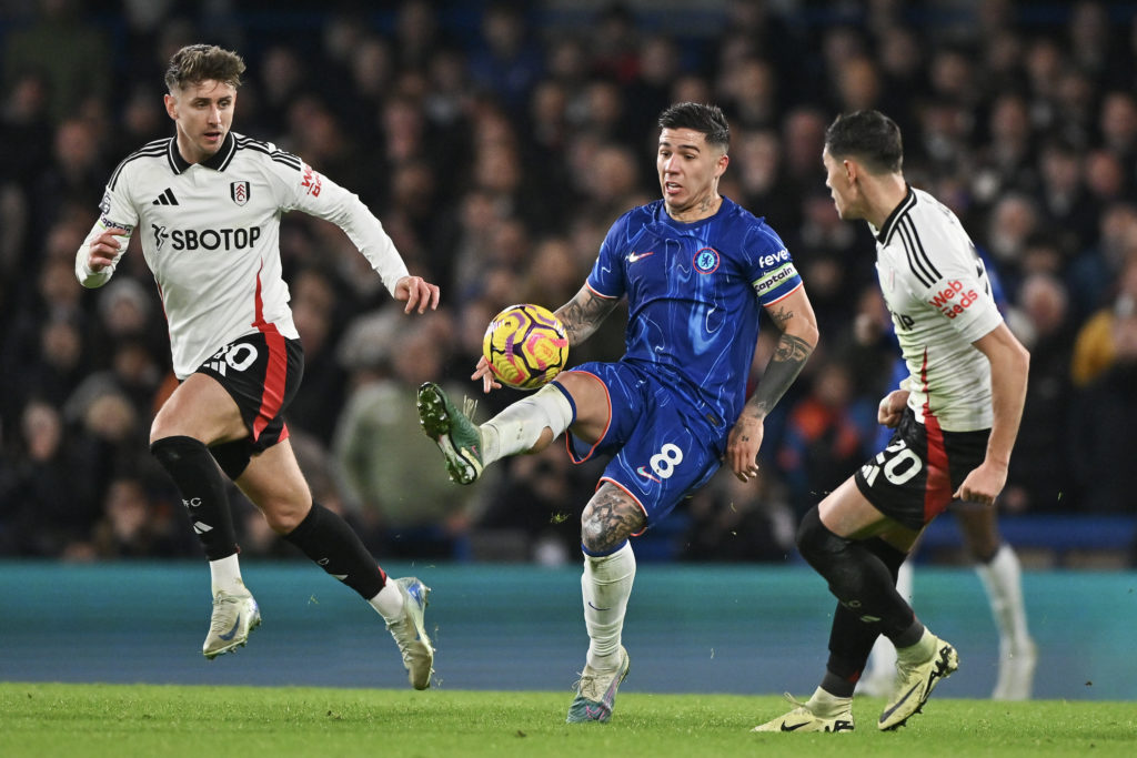 Enzo Fernandez of Chelsea, Tom Cairney of Fulham and Sasa Lukic of Fulham in action during the Premier League match between Chelsea FC and Fulham F...