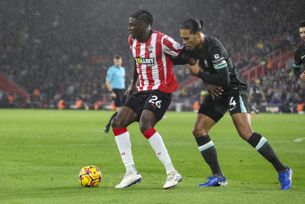 Lesley Ugochukwu of Southampton holds off Virgil Van Dijk of Liverpool during the Premier League match between Southampton FC and Liverpool FC at S...