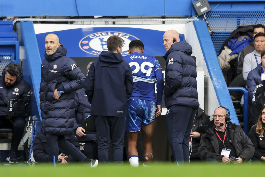 Wesley Fofana of Chelsea goes off injured during the Premier League match between Chelsea FC and Aston Villa FC at Stamford Bridge on December 01, ...