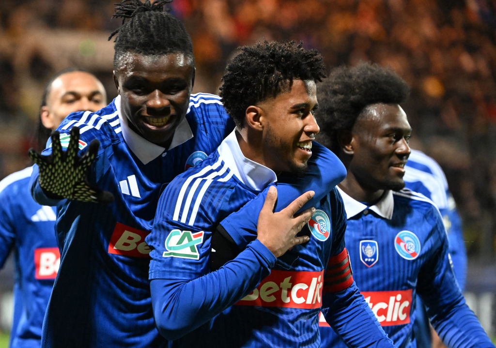 Calais'Stasbourg's Brazilian midfielder #08 Andrey Dos Santos celebrates with teammates after scoring his team's first goal during the French Cup r...