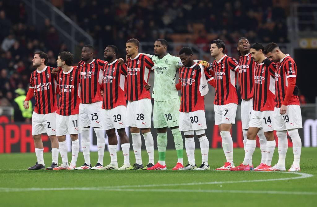 Players of AC Milan observe a minute of silence before the Serie A match between AC Milan and Cagliari at Stadio Giuseppe Meazza on January 11, 202...