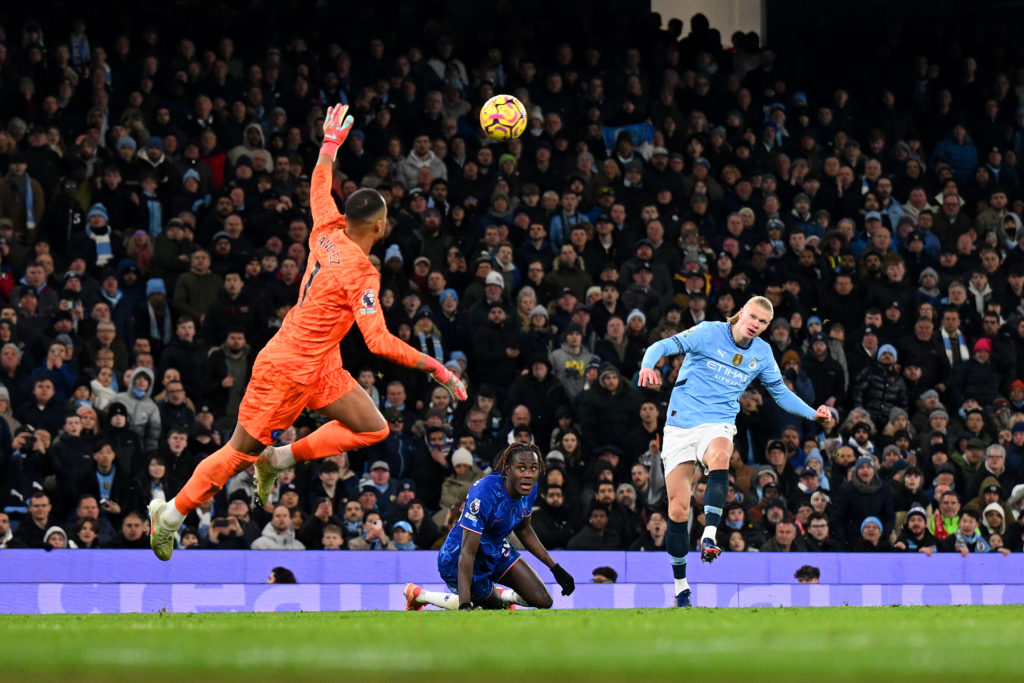 Erling Haaland of Manchester City scores his team's second goal past Robert Sanchez of Chelsea during the Premier League match between Manchester C...