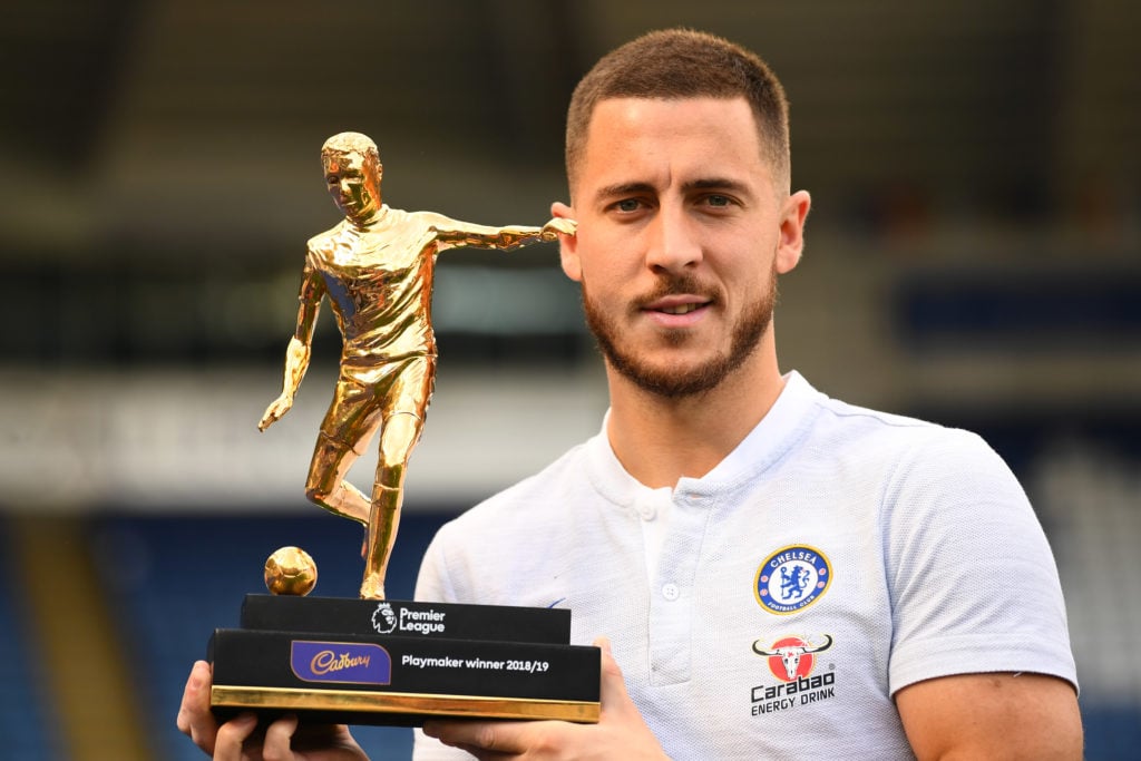 Eden Hazard of Chelsea poses for a photo with the Playmaker winner trophy