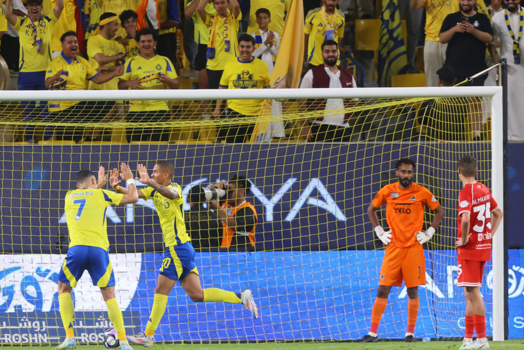 Nassr's Brazilian Forward #20 Angelo Gabriel celebrates scoring his team's first goal with Nassr's Portuguese forward #07 Cristiano Ronaldo during ...