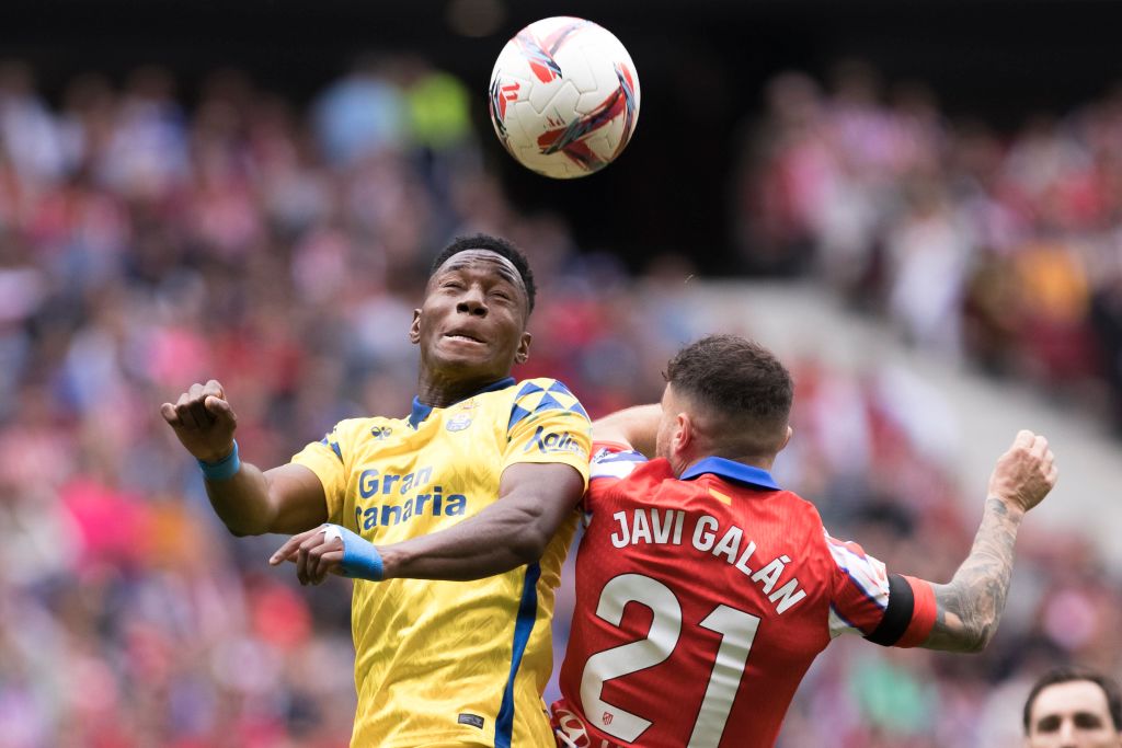 Javi Galan of Atletico de Madrid and Dario Essugo of Las Palmas fight for the ball during the La Liga 2024/25 match between Atletico de Madrid and ...