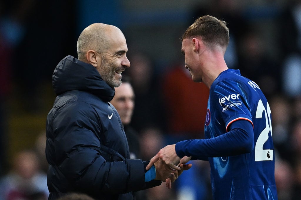 Enzo Maresca, Manager of Chelsea, talks to Cole Palmer of Chelsea as Palmer is substituted off during the Premier League match between Chelsea FC a...