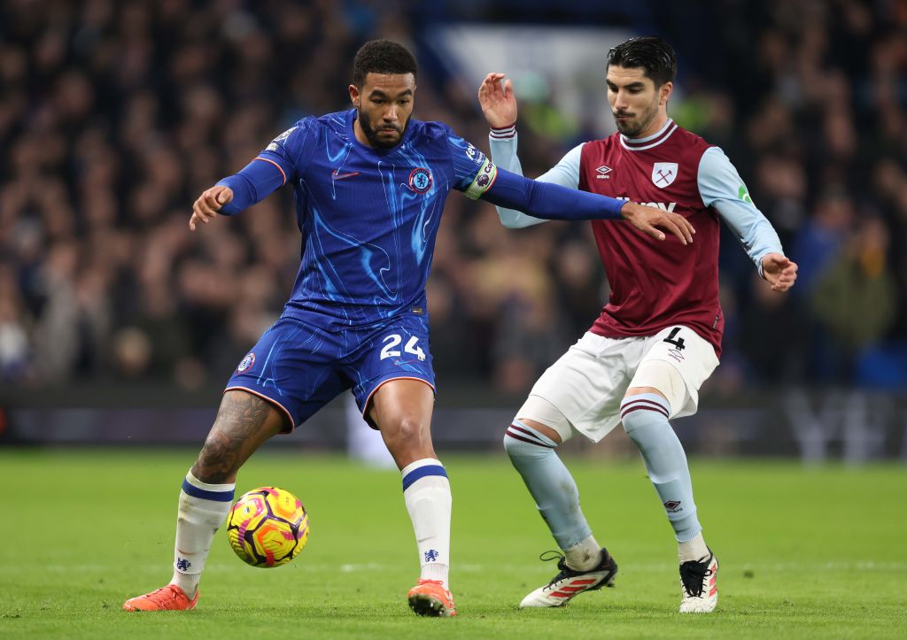 Reece James of Chelsea battles Carlos Soler of West Ham United during the Premier League match between Chelsea FC and West Ham United FC at Stamfor...