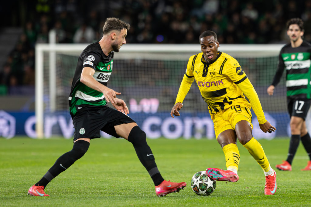 Jamie Gittens of Borussia Dortmund with Zeno Debast of