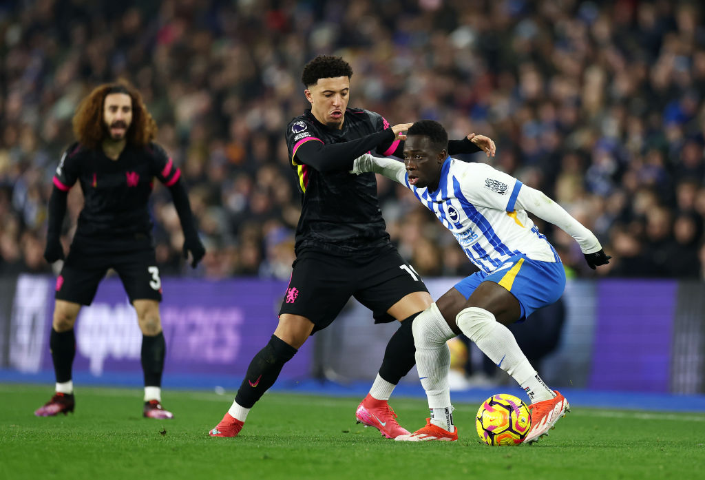 Yankuba Minteh of Brighton & Hove Albion is challenged by Jadon Sancho of Chelsea during the Premier League match between Brighton & Hove A...