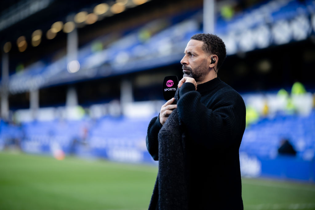 Rio Ferdinand looks on ahead of the Premier League match between Everton and Manchester United