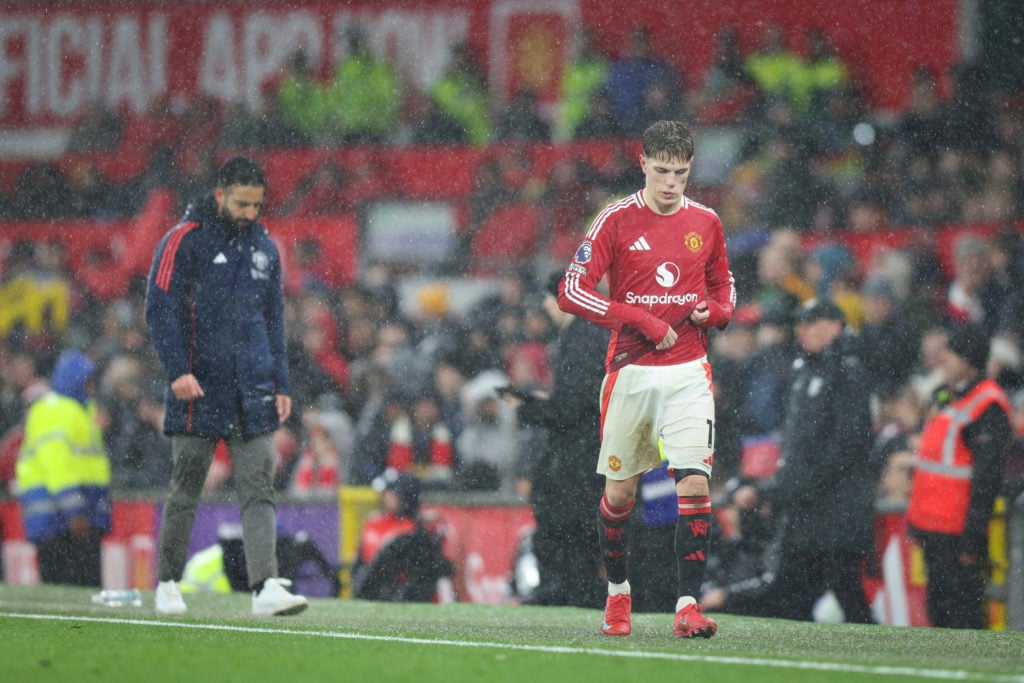 Alejandro Garnacho of Manchester United walks past Ruben Amorim the head coach / manager of Manchester United after being substituted during the Premier League match between Manchester United FC and Ipswich Town