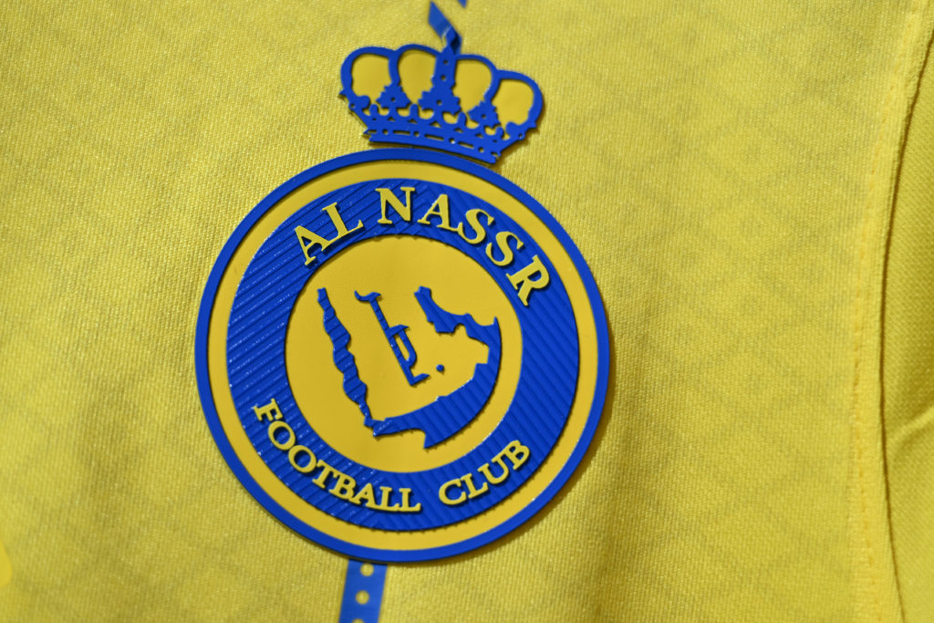 Al-Nassr FC badge on a shirt