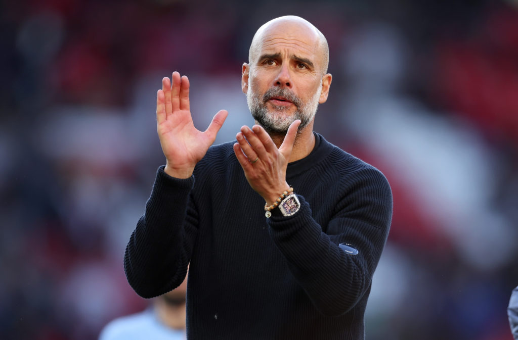 Pep Guardiola, manager of Manchester City, applauds the fans