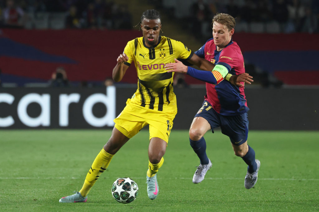 Carney Chukwuemeka and Frenkie de Jong play during the match between FC Barcelona and Borussia Dortmund, corresponding to the first leg of the Quarter-final of the UEFA Champions League, at the Lluis Companys Stadium in Barcelona, Spain, on April 9, 2025.