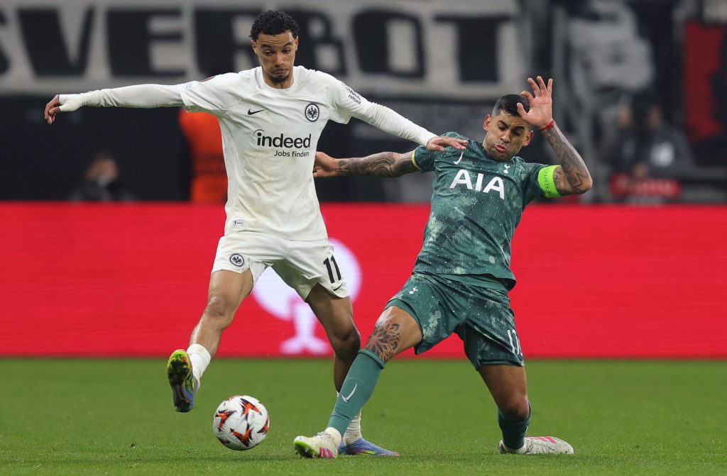 Hugo Ekitike of Eintracht Frankfurt battles for the ball with Cristian Romero of Tottenham Hotspur