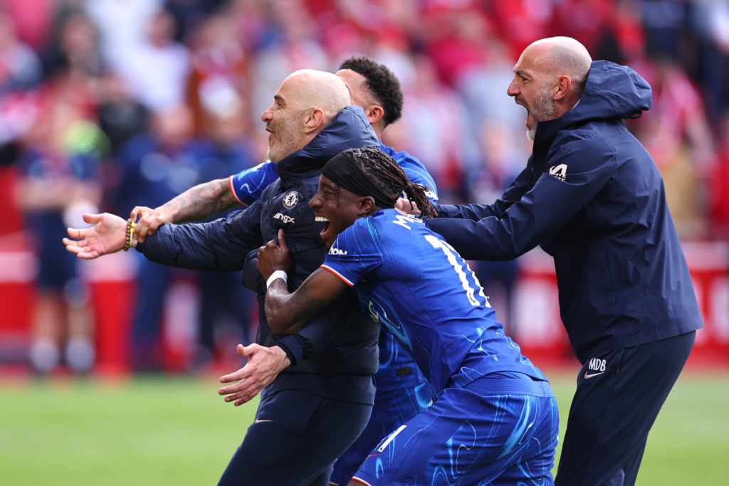 Enzo Maresca and Noni Madueke celebrate Chelsea qualifying for the Champions League