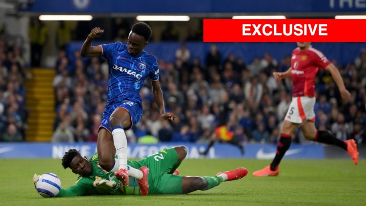 Chelsea's Tyrique George tackled by Manchester United goalkeeper Andre Onana in the Premier League