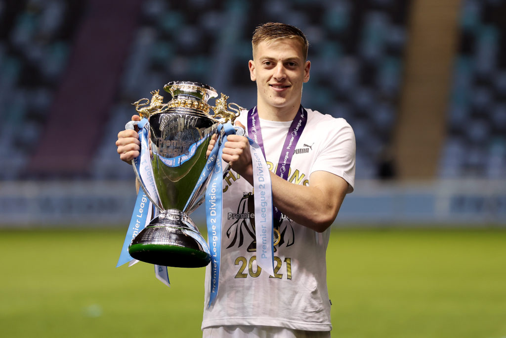Liam Delap lifts the trophy after Manchester City v Tottenham Hotspur - Premier League 2
