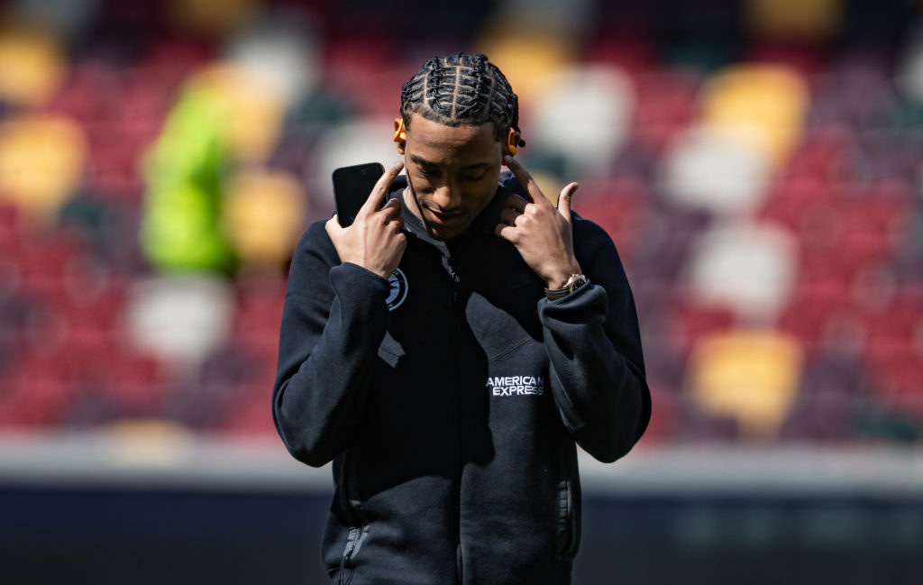 Joao Pedro inspects the pitch ahead of Brentford FC v Brighton & Hove Albion FC - Premier League