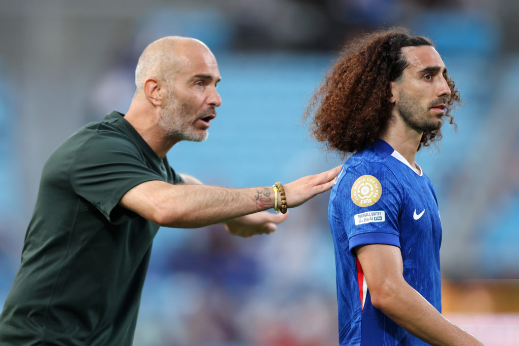 Enzo Maresca, Head Coach of Chelsea FC, speaks with Marc Cucurella #3