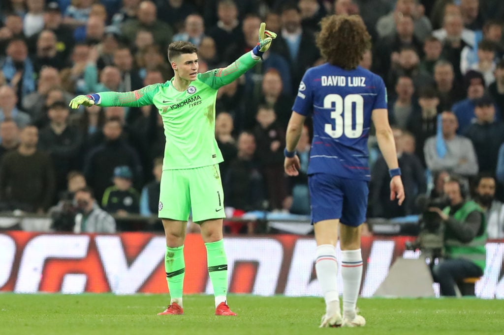Kepa Arrizabalaga gestures to manager Maurizio Sarri during Chelsea v Manchester City - Carabao Cup Final