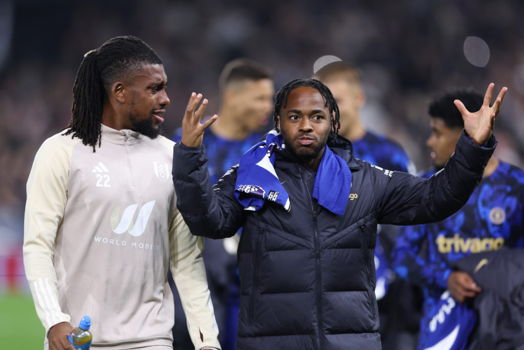 Alex Iwobi of Fulham and Raheem Sterling of Chelsea talking