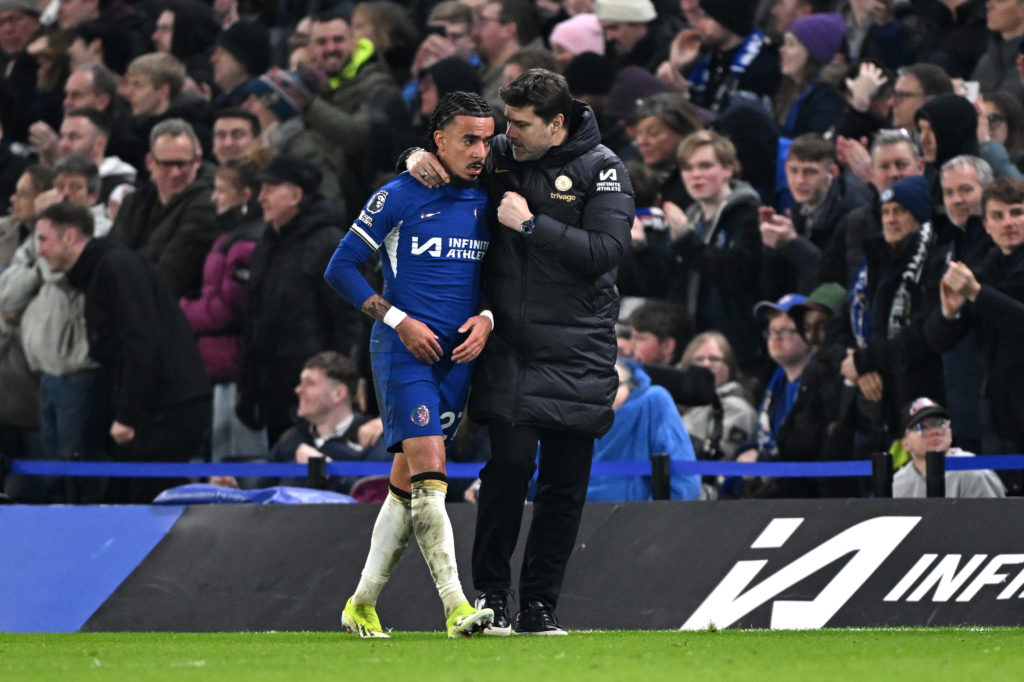 Mauricio Pochettino chats with Malo Gusto during Chelsea's match against Newcastle United in the Premier League.