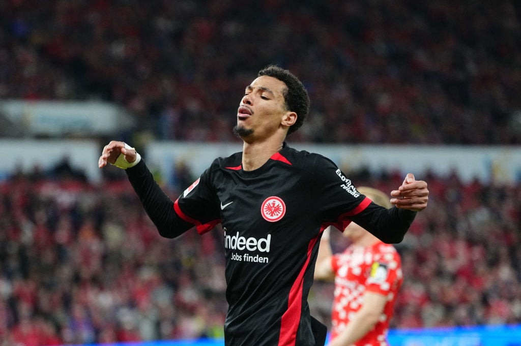 Hugo Ekitike reacts during Bundesliga match between 1. FSV Mainz 05 and Eintracht Frankfurt, inset mystery player
