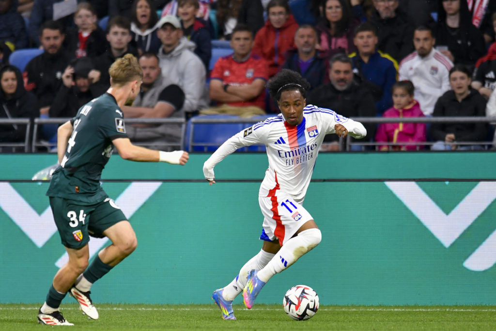 Malick Fofana takes on Tom Pouilly during Olympique Lyonnais v Racing Club de Lens - Ligue 1 McDonald's