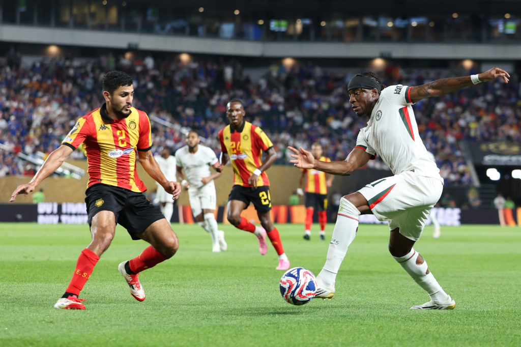 Chelsea winger Noni Madueke taking on ES Tunis defender
