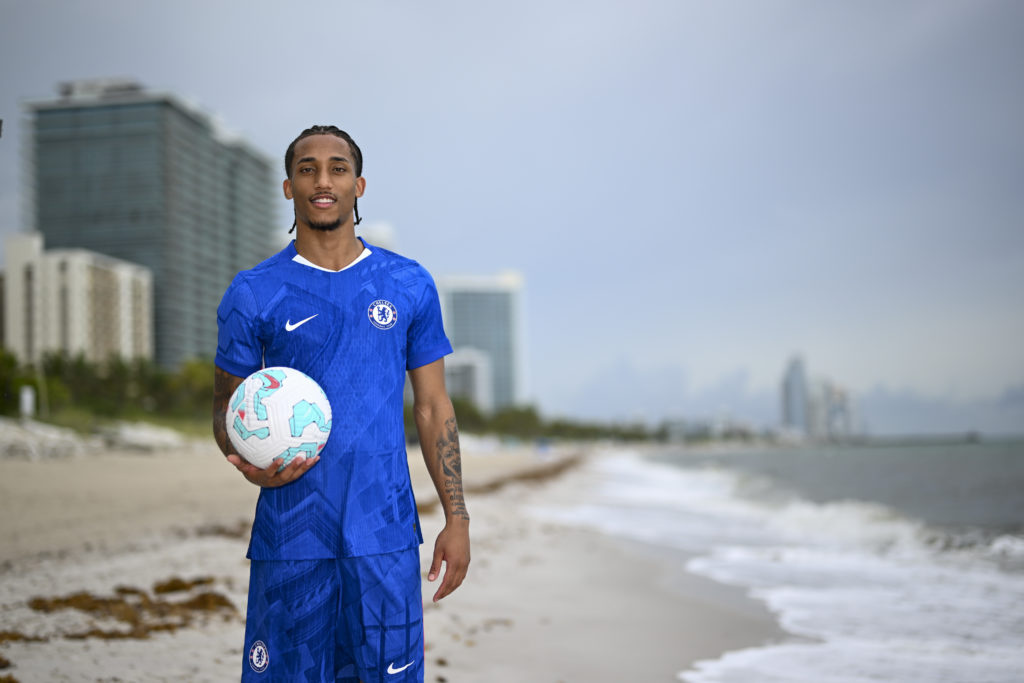 Joao Pedro posing in the Chelsea kit after officially signing for the Blues.