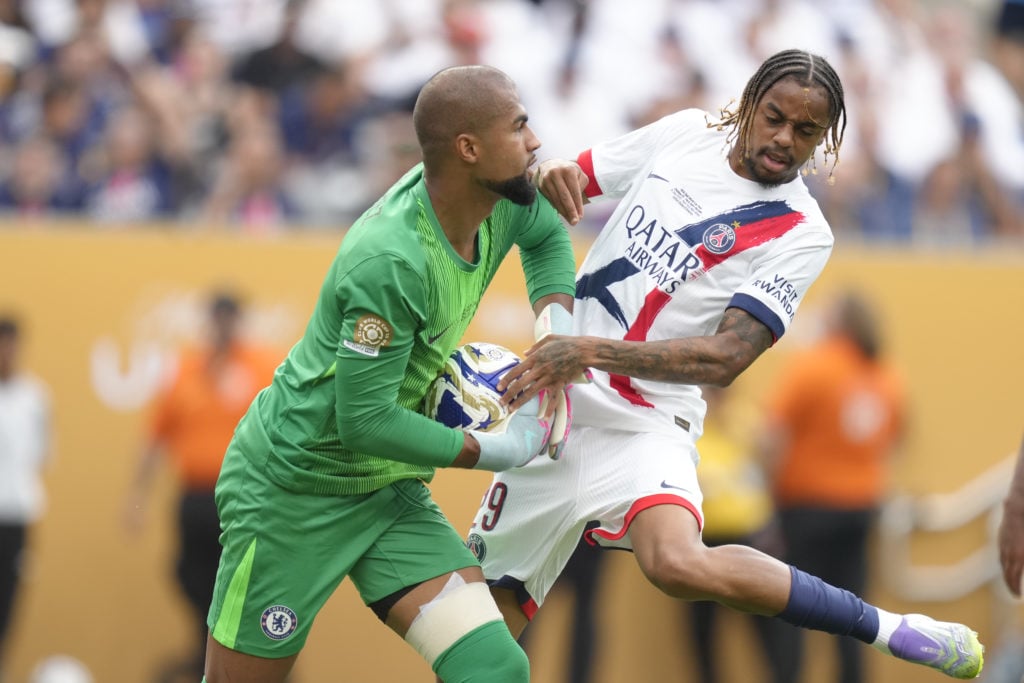 Robert Sanchez battles Bradley Barcola for the ball during Chelsea v PSG - FIFA Club World Cup 2025 Final