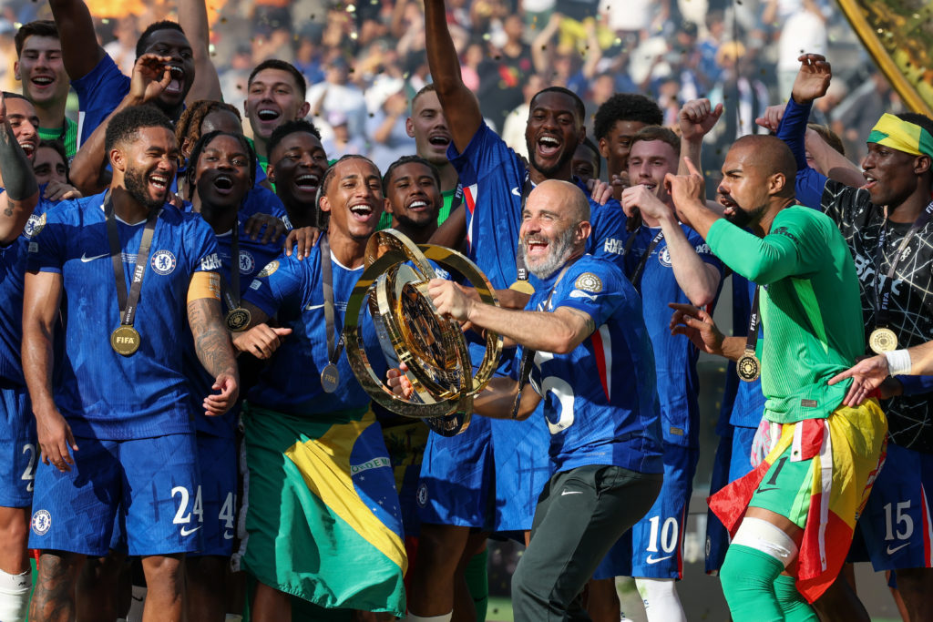 Chelsea manager Enzo Maresca preparing to lift up Club World Cup trophy