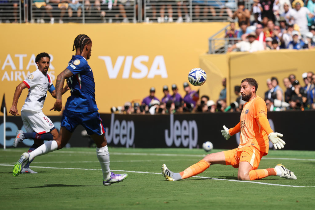Joao Pedro lifts the ball over Gianluigi Donnarumma to score Chelsea's third goal against PSG in the Club World Cup Final.