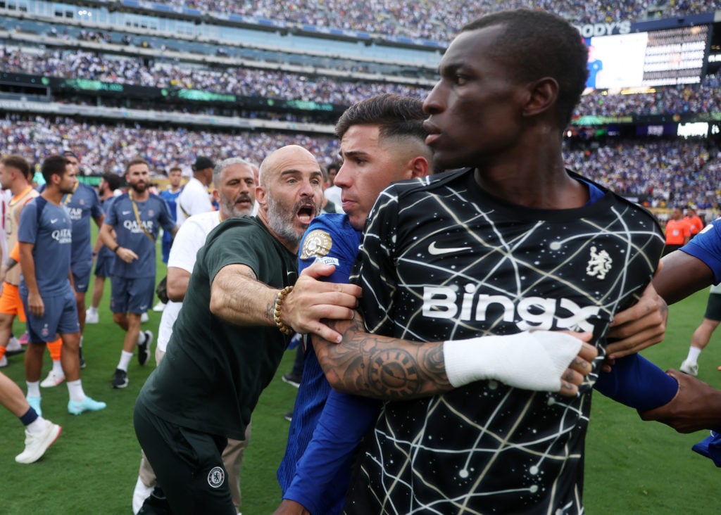 Enzo Maresca and Enzo Fernandez holding back Nicolas Jackson after Chelsea's win against PSG