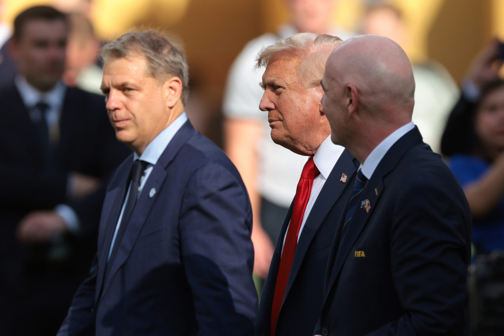 Chelsea owner Todd Boehly, Donald Trump President of the United States of America and Gianni Infantino President of FIFA make their way to the podium